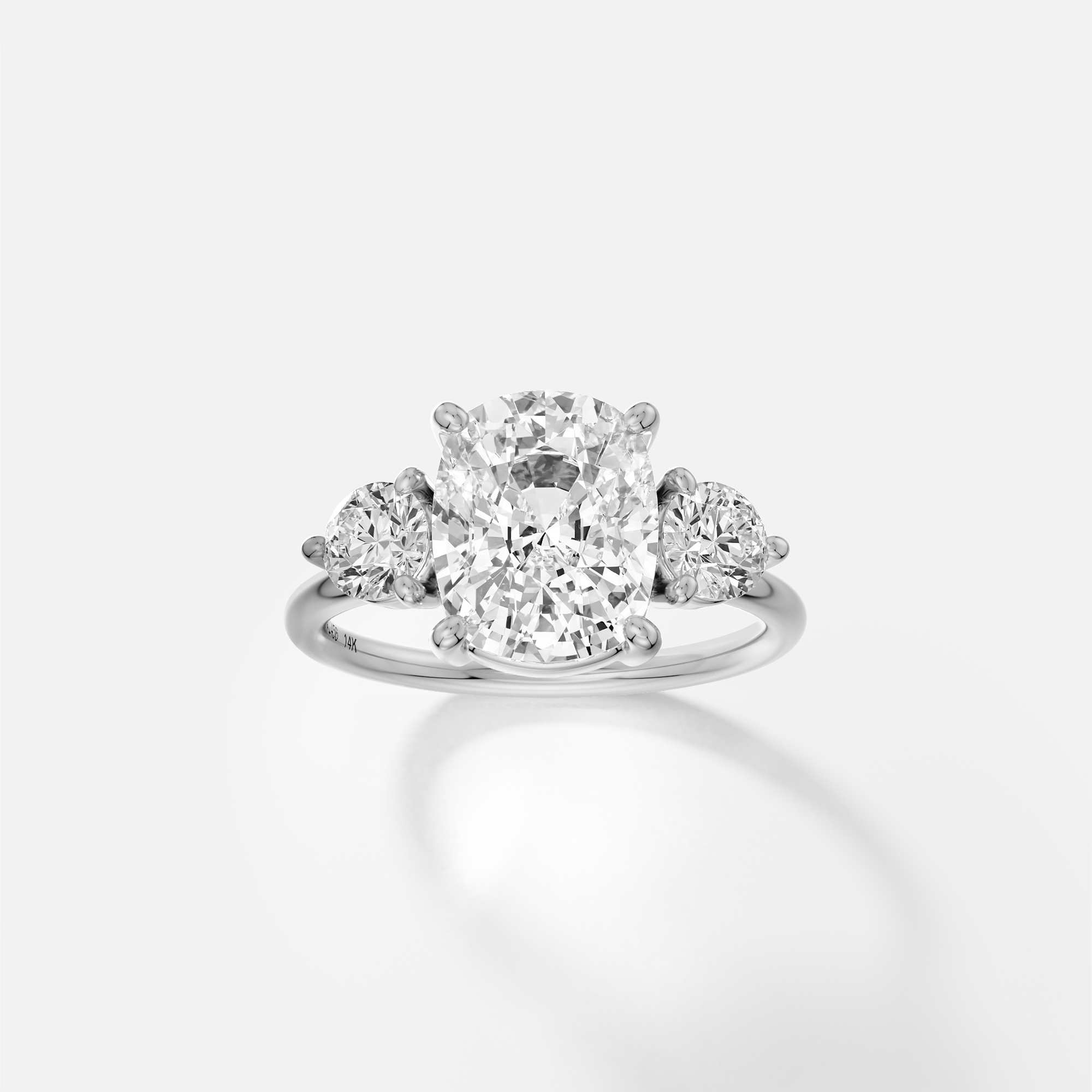 Kala elongated cushion diamond three stone engagement ring front view in platinum