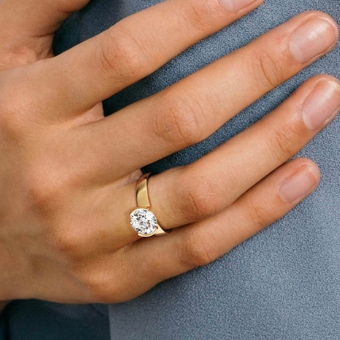 Miri 2 ct round diamond tapered partial bezel ring close hand detail