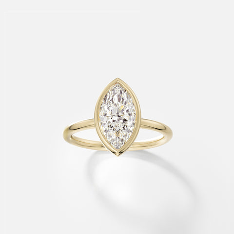 14k yellow gold engagement ring with 2 carat marquise diamond set north south in thin bezel on delicate round band