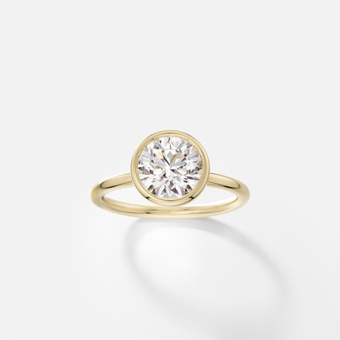 Arti round diamond bezel engagement ring front view in 14k yellow gold