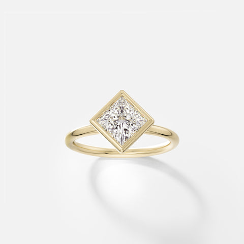 14k yellow gold engagement ring with 1.50 carat tilted princess-cut diamond in thin bezel on delicate round band