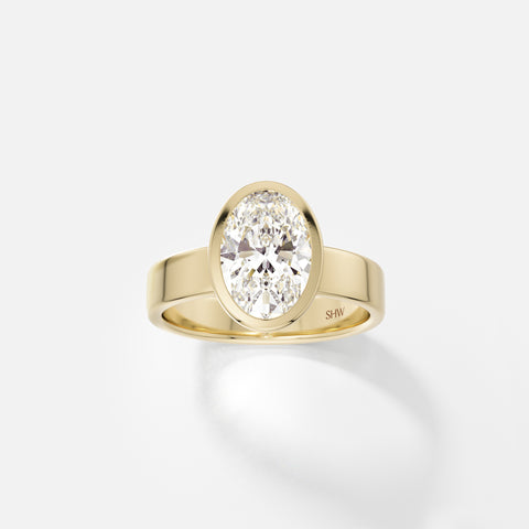 14k yellow gold wide flat band engagement ring with 2 carat oval diamond set north south in thin bezel