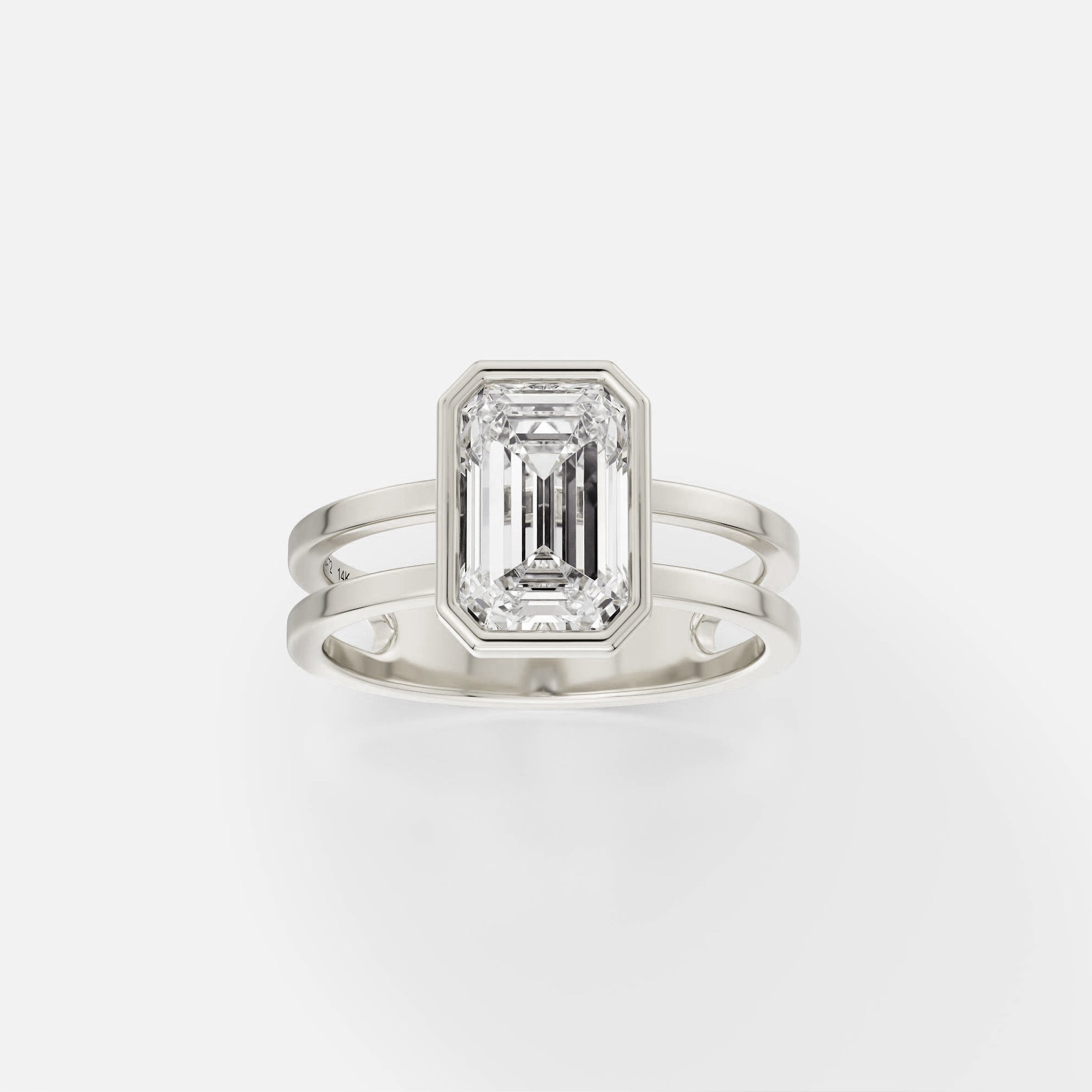 14k white gold double band engagement ring with 2 carat emerald-cut diamond in thin bezel setting