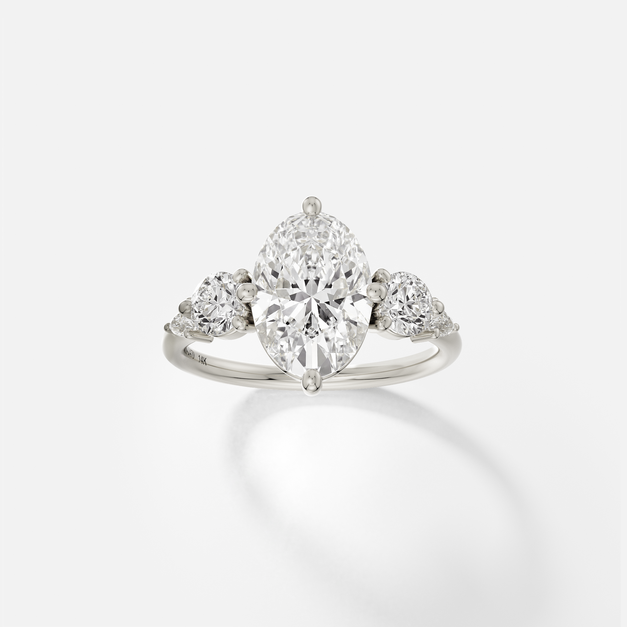 14k white gold five stone engagement ring with 2.50 ct oval diamond and pear and round accent stones