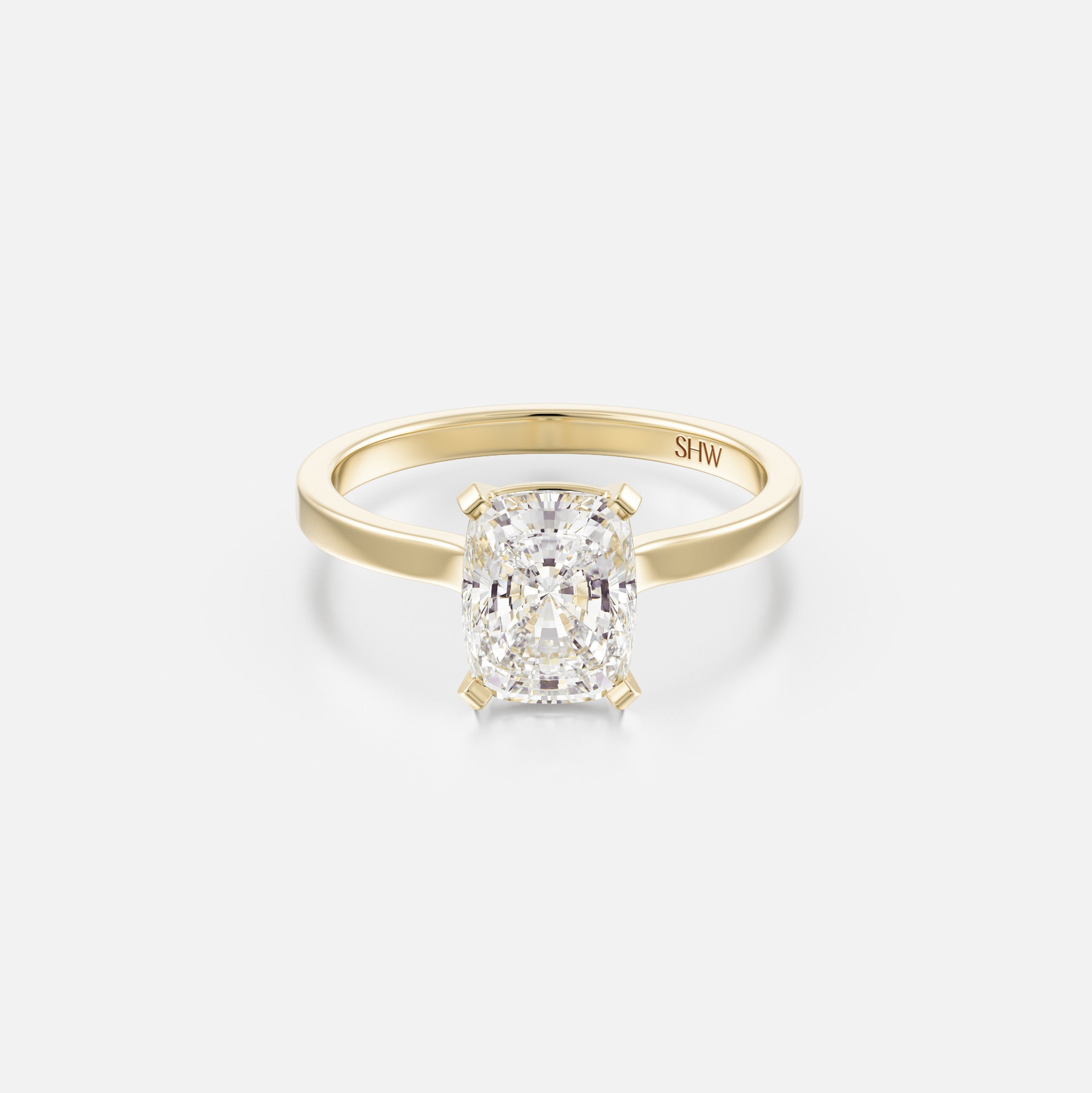 14k yellow gold thin flat band engagement ring with 1.50 carat cushion diamond set north south with corner prongs