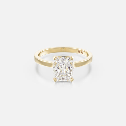 14k yellow gold thin flat band engagement ring with 1.50 carat cushion diamond set north south with corner prongs