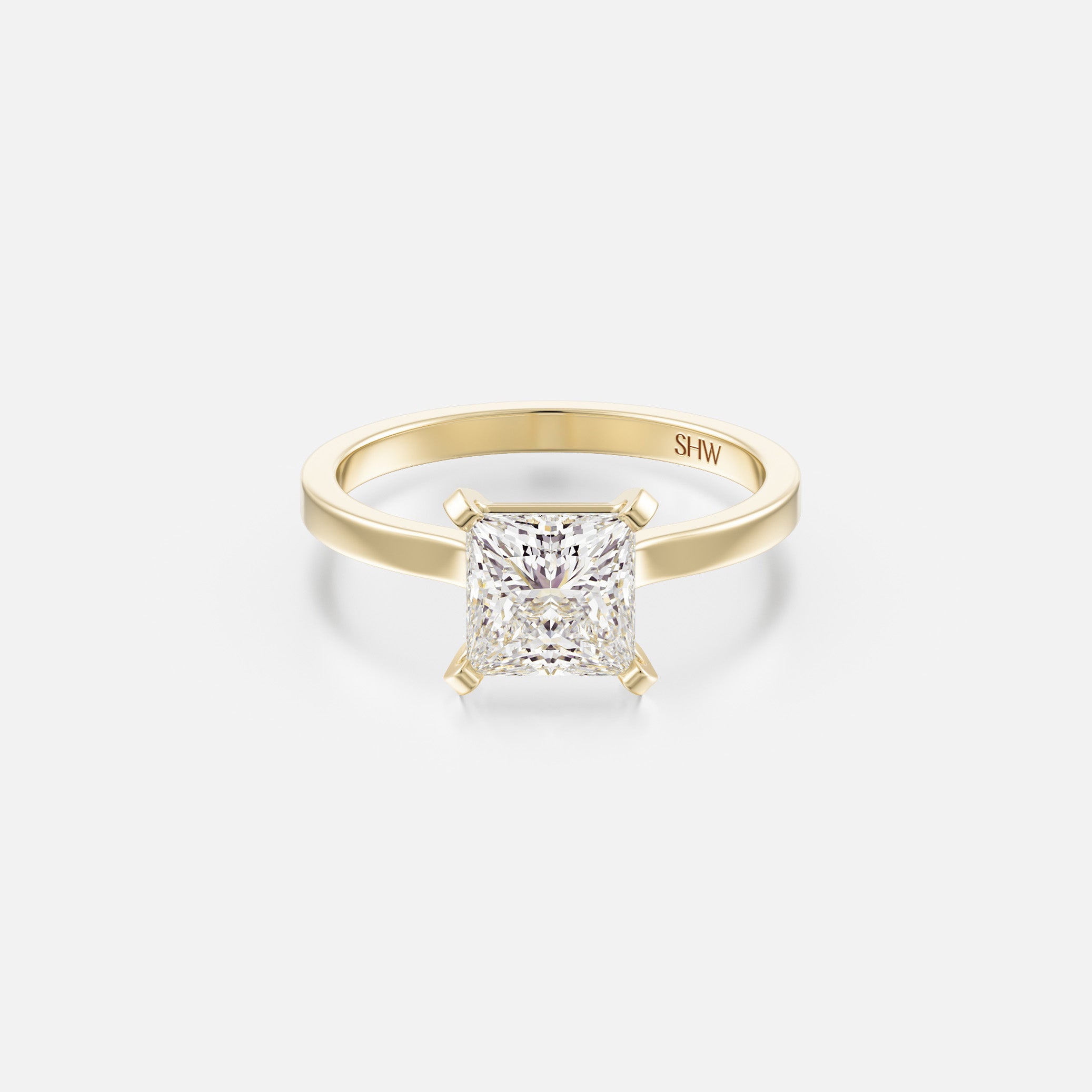 14k yellow gold thin flat band engagement ring with 1.50 carat princess-cut diamond set with corner prongs