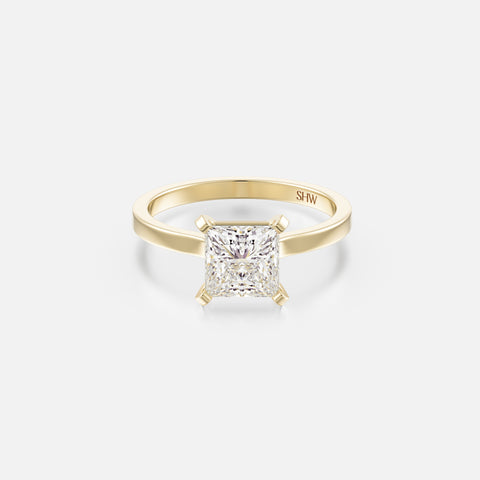 14k yellow gold thin flat band engagement ring with 1.50 carat princess-cut diamond set with corner prongs