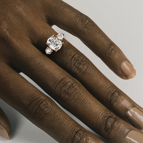 Kala 3.25 carat elongated cushion diamond three stone ring close hand detail