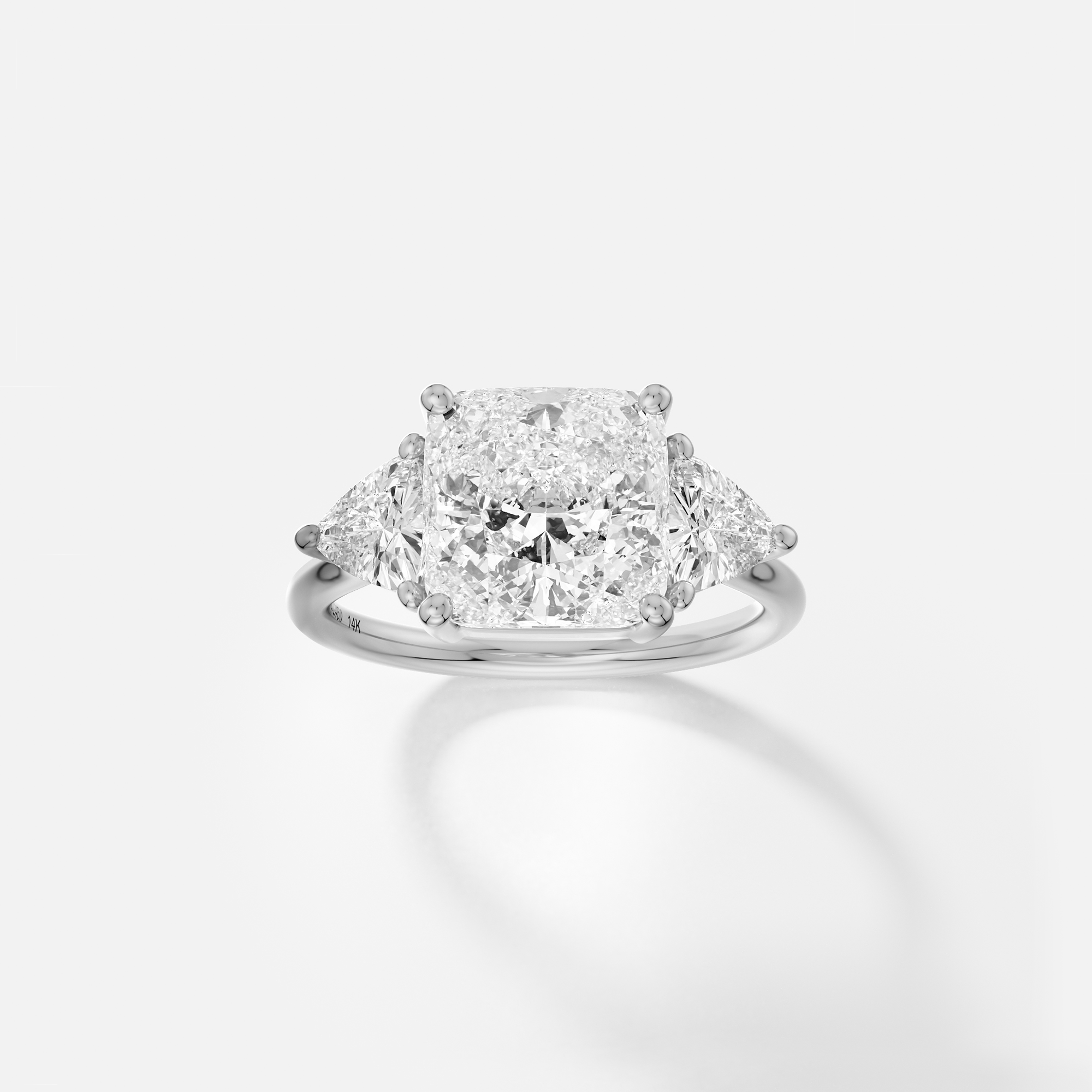Kala cushion diamond trillion three stone engagement ring front view in platinum