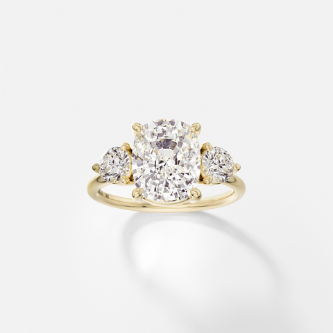Kala elongated cushion diamond three stone engagement ring with round side stones front view in 14k yellow gold