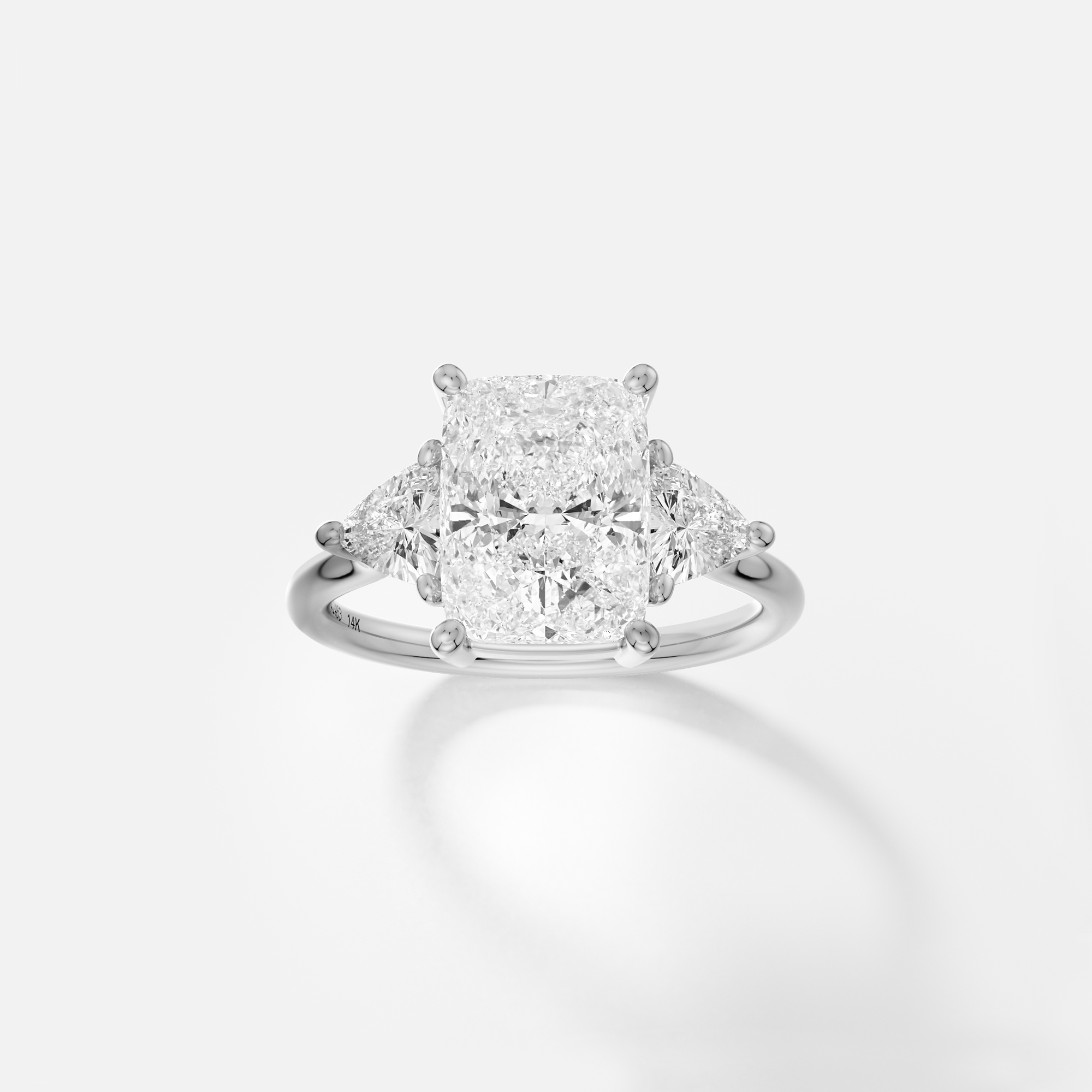 platinum engagement ring with 3.00 carat elongated cushion diamond and trillion side diamonds on delicate band