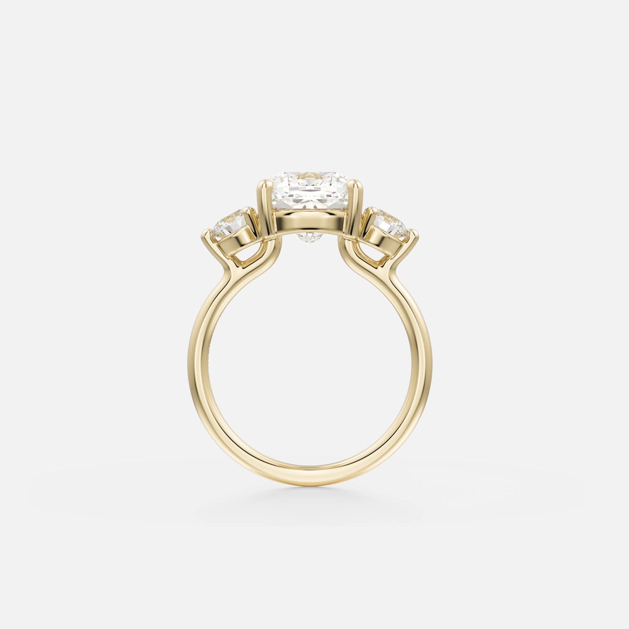 14k yellow gold engagement ring with 3.25 carat cushion diamond and round side stones in corner prong setting side view