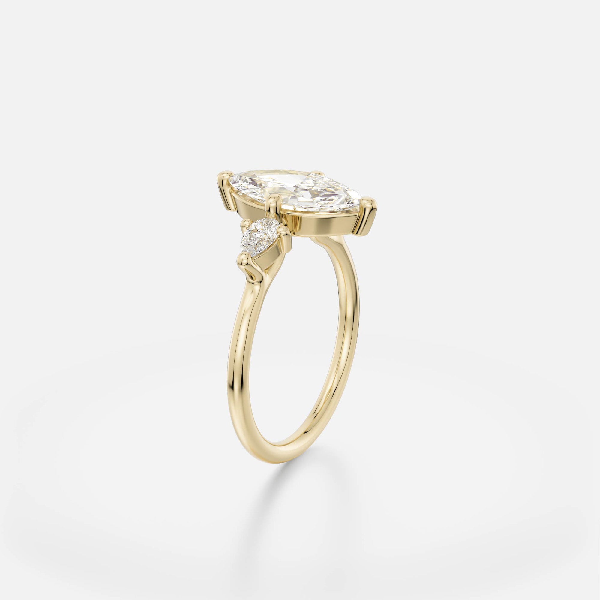 2 ct marquise-cut diamond engagement ring with pear accent stones in compass prong setting on thin round band open setting