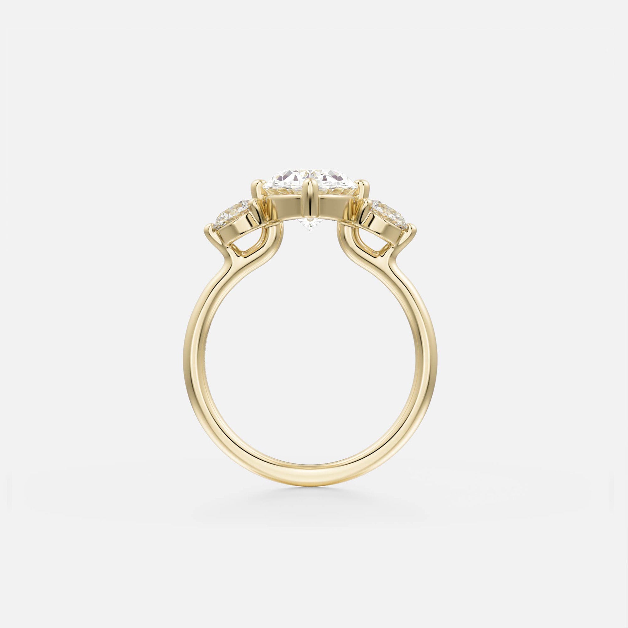 14 karat yellow gold engagement ring with oval center diamond and round accent stones in prong setting on slender band