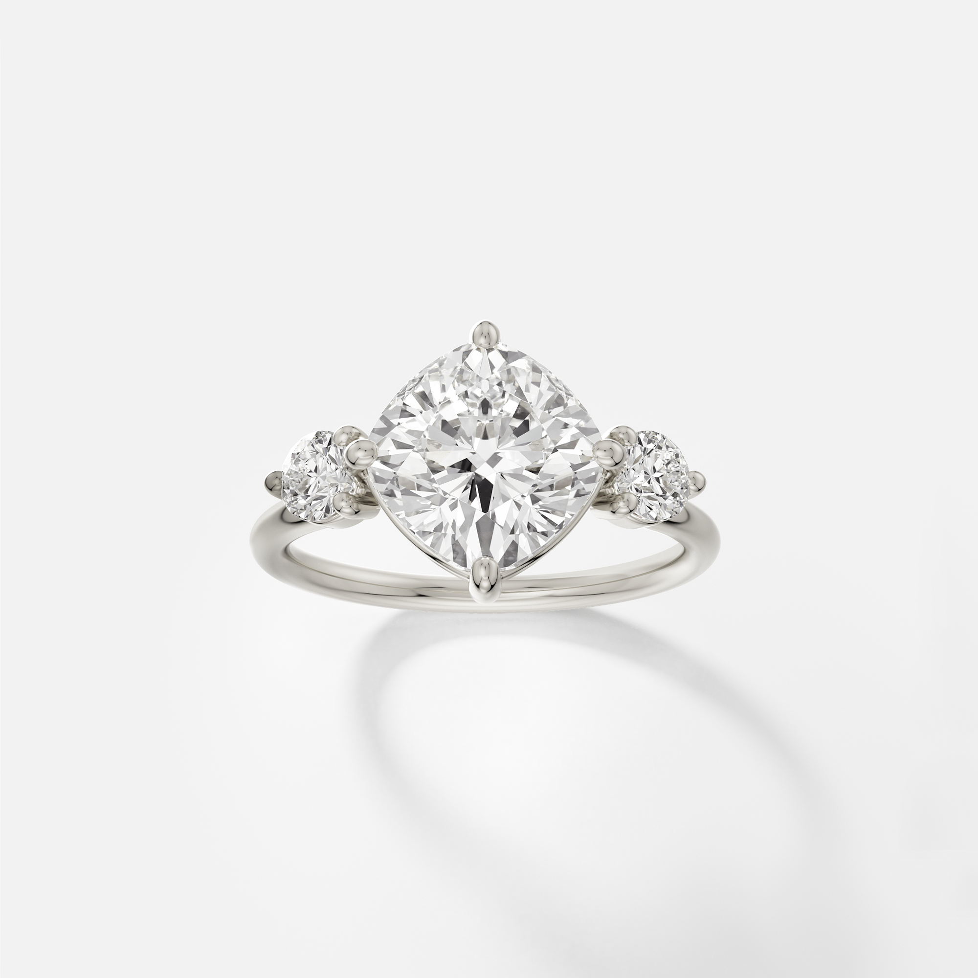 14k white gold engagement ring with 3.25 carat tilted cushion diamond in compass prongs on delicate round band