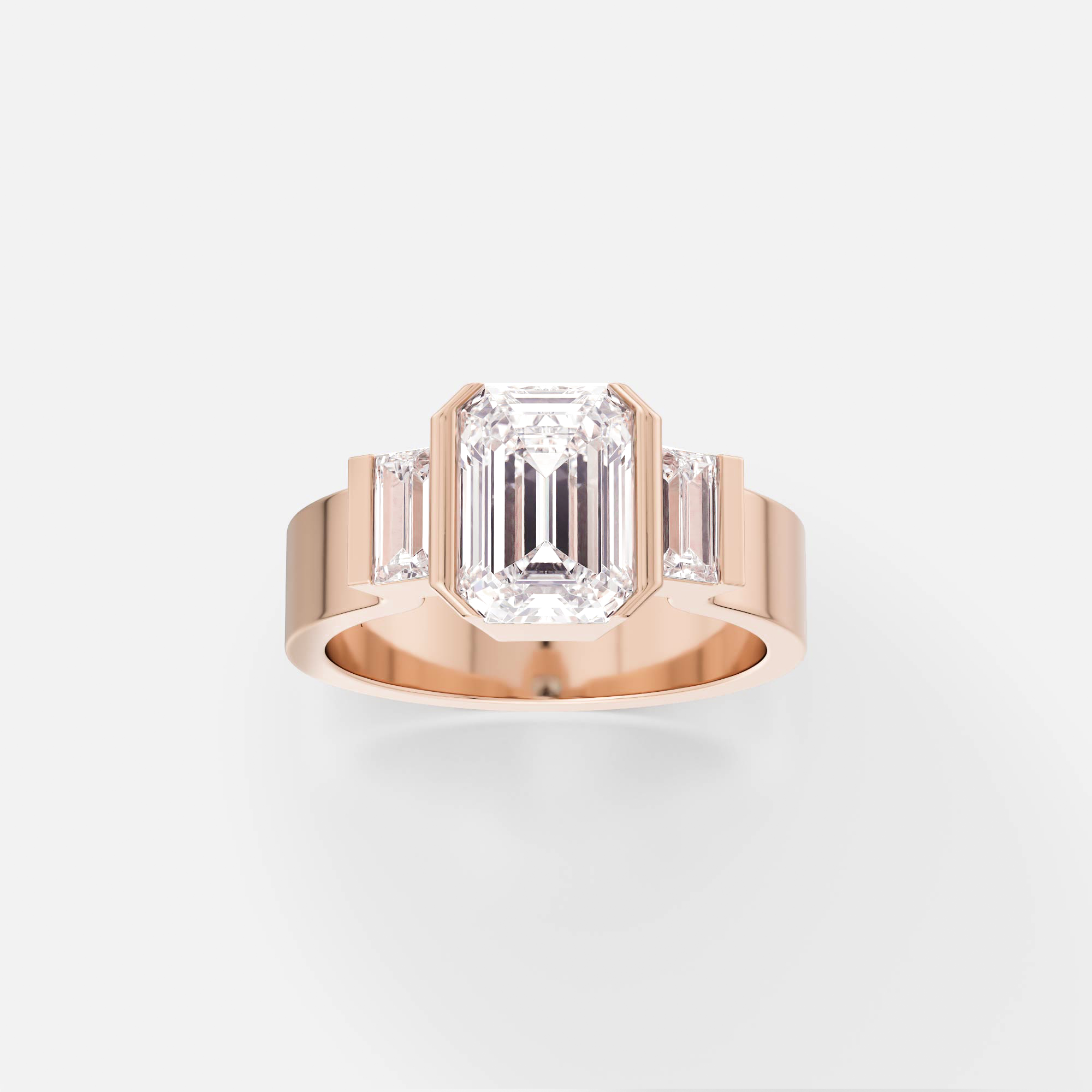14k rose gold three stone engagement ring with emerald-cut center diamond and baguette accents in partial bezel