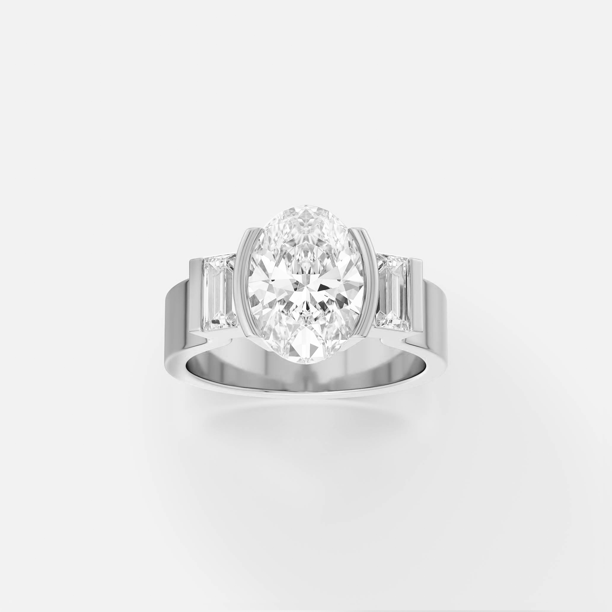 platinum engagement ring with oval diamond and baguette side stones in modern partial bezel design