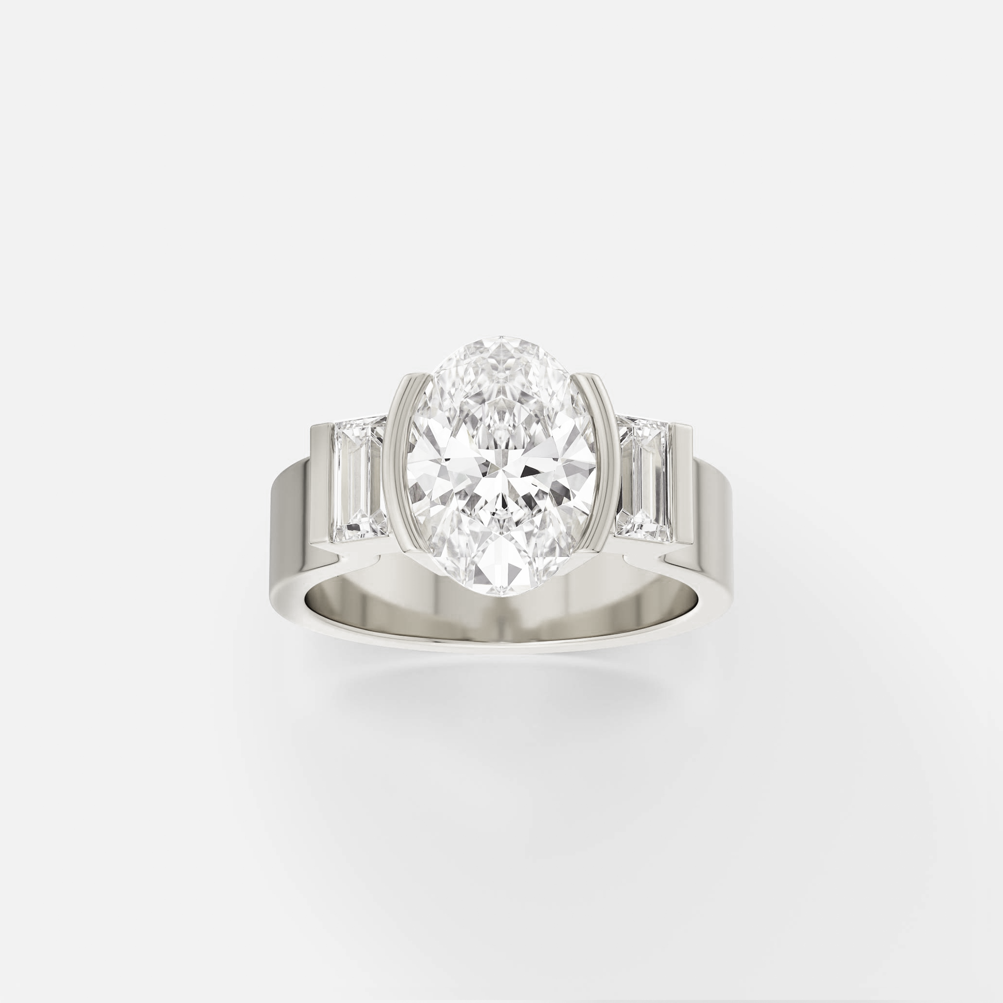 14k white gold engagement ring with oval diamond and baguette side stones in minimal partial bezel setting