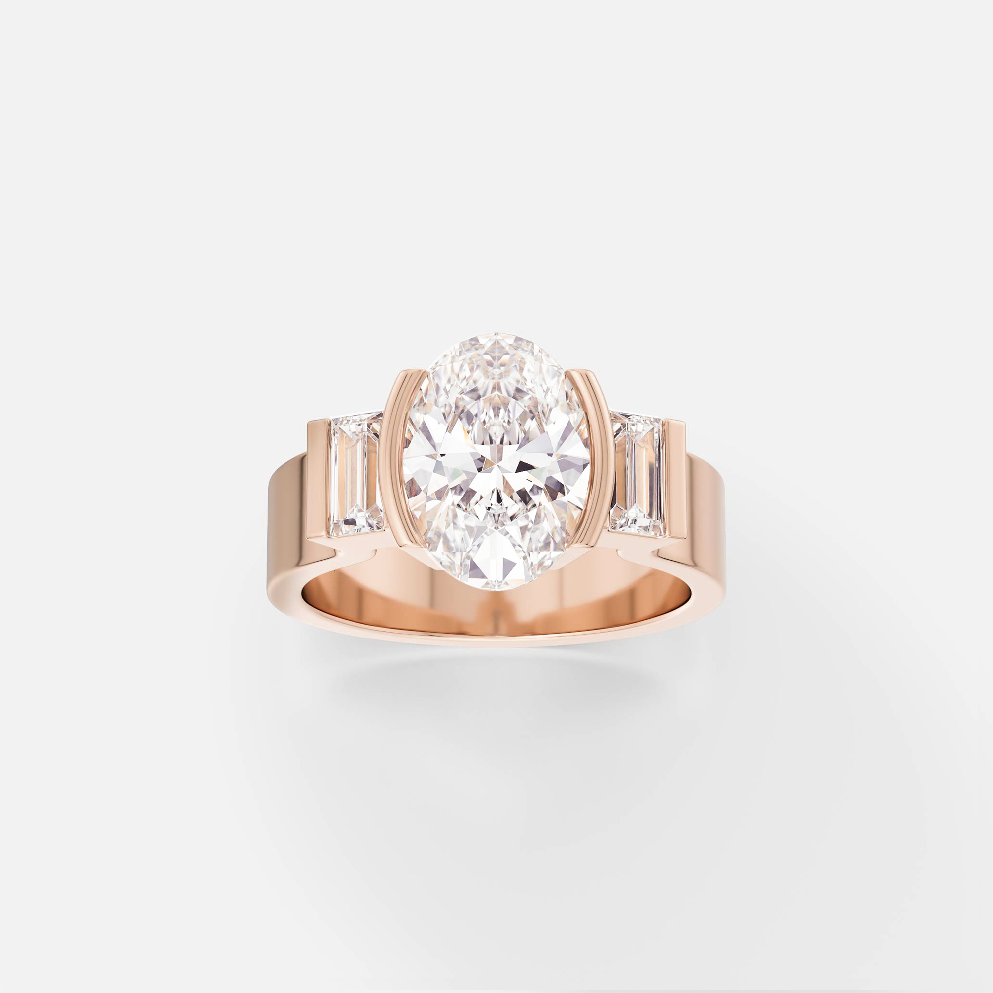 14k rose gold three stone engagement ring with oval-cut center diamond and baguette accents in partial bezel