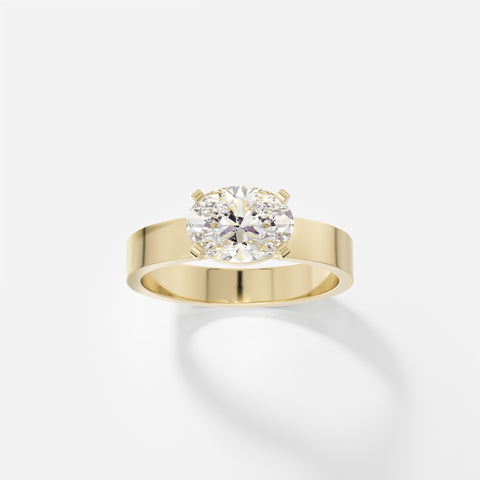 14k yellow gold engagement ring with 1.50 carat east-west oval diamond in corner prongs on sculptural flat profile band
