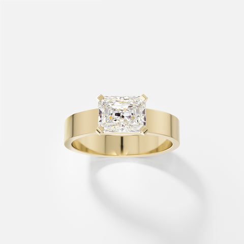 14k yellow gold engagement ring with 1.50 carat radiant-cut diamond set east west in corner prongs on flat profile band