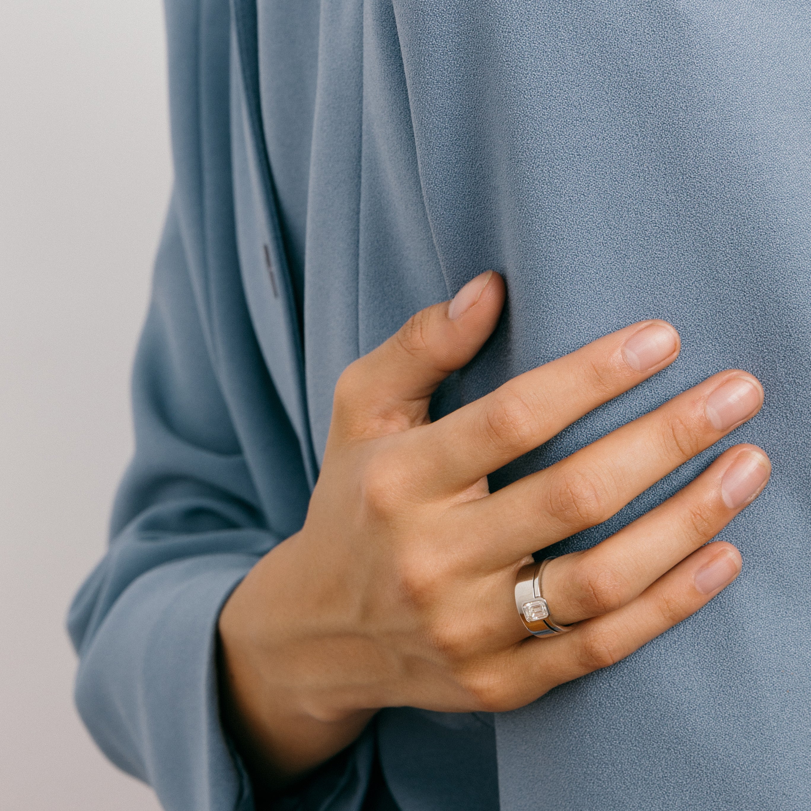 Minimal Thin Bezel Engagement Ring with 1ct natural canadamark emerald-cut diamond in platinum by SHW famous fine jewelry stores in NYC