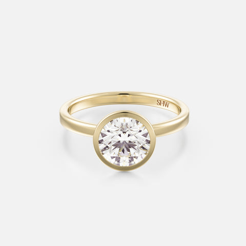 14k yellow gold thin flat band engagement ring with 1.75 carat round brilliant-cut diamond in bezel setting