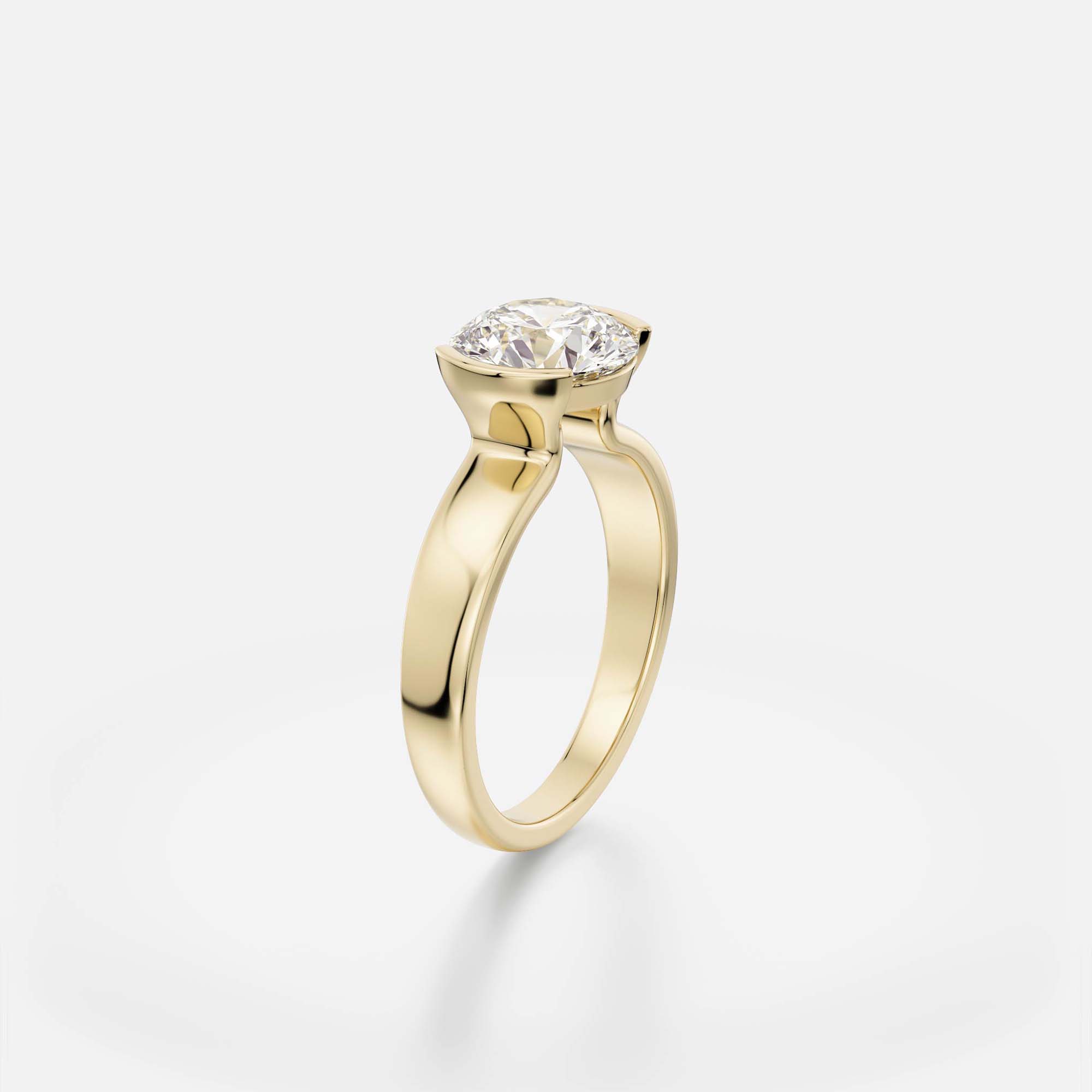 Miri round diamond tapering bezel engagement ring angled view