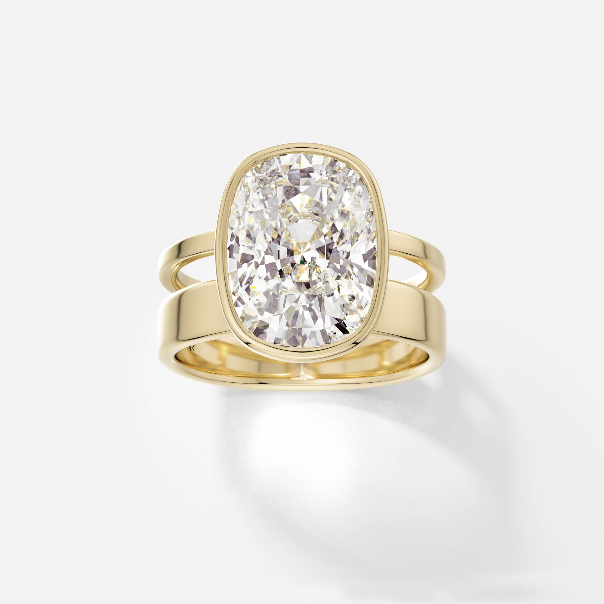 14k yellow gold engagement ring with 4.00 carat cushion-cut diamond set north-south in bezel setting on sculptural double band