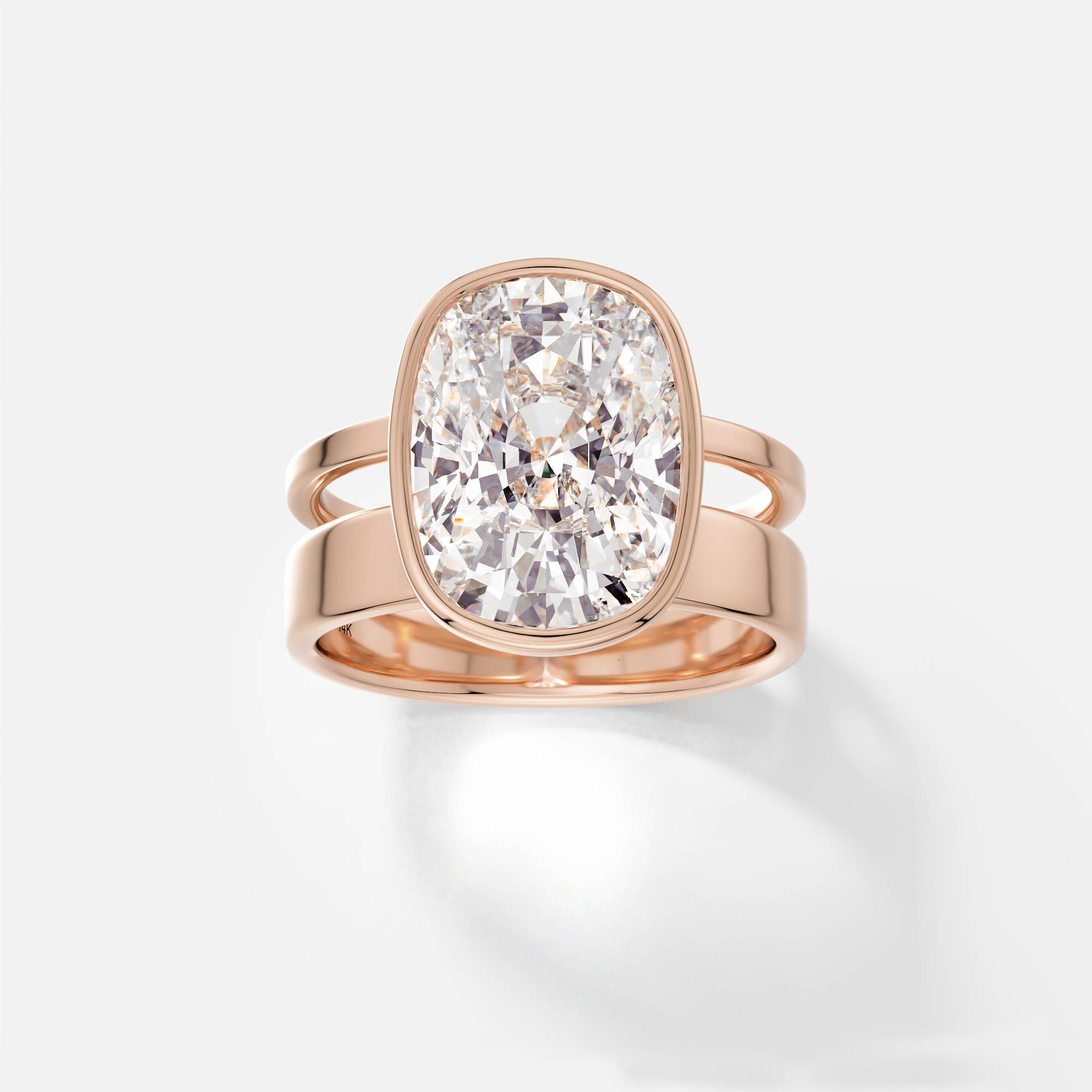14k rose gold engagement ring with 4 carat cushion-cut diamond bezel set on modern double band design