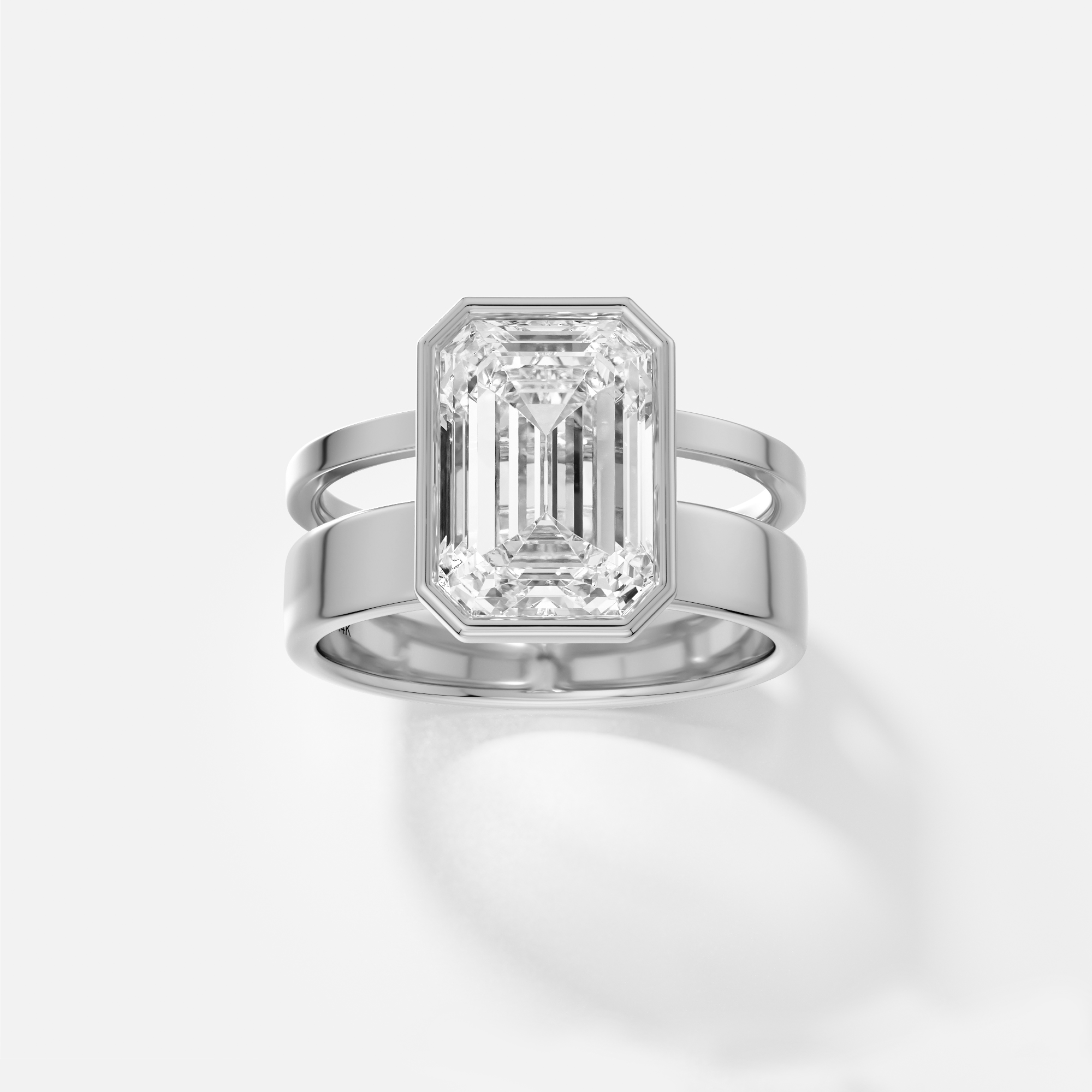 platinum engagement ring with 4.00 carat emerald-cut diamond in open bezel setting on connected double band