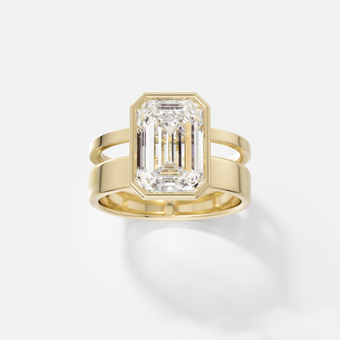 14k yellow gold engagement ring with 4.00 carat emerald-cut diamond in bezel setting on sculptural double band design