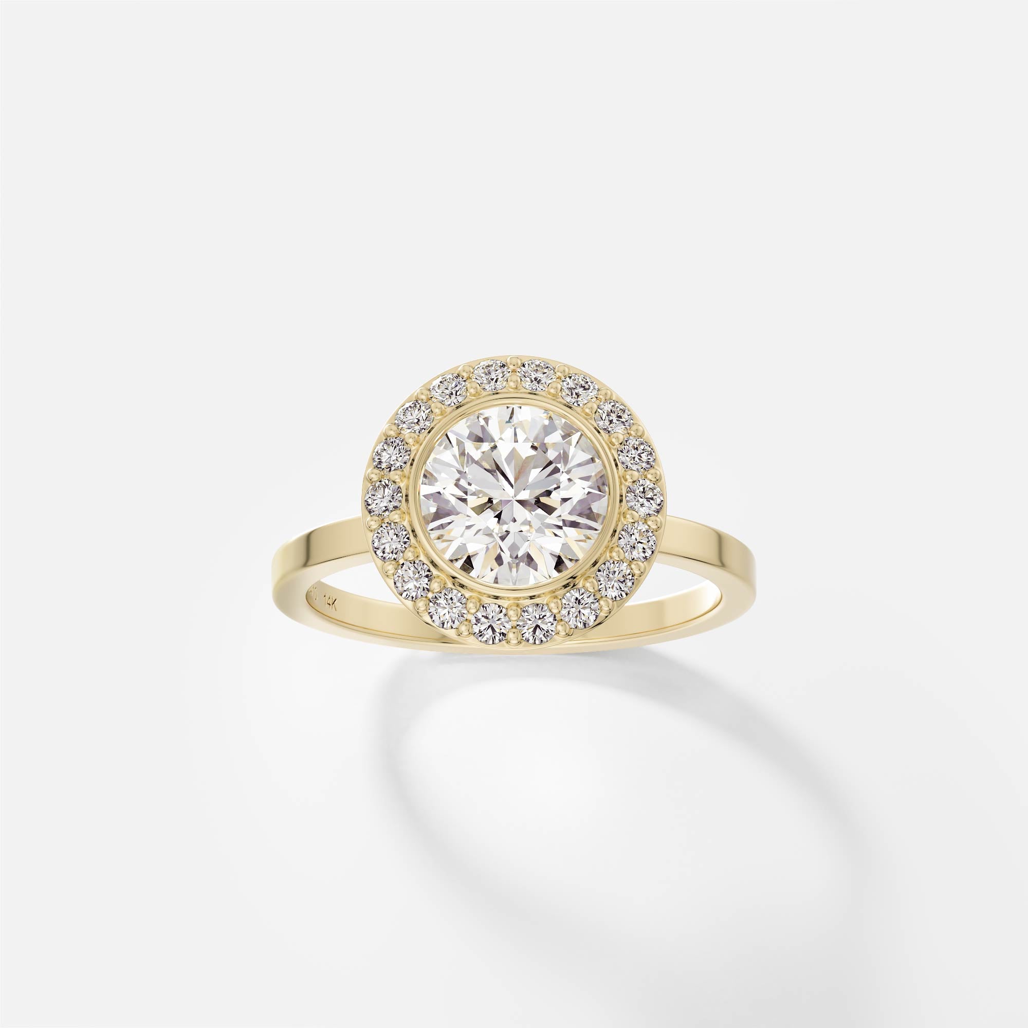 14k yellow gold engagement ring with 1.25 carat round brilliant diamond in bezel halo with pavé diamond surround