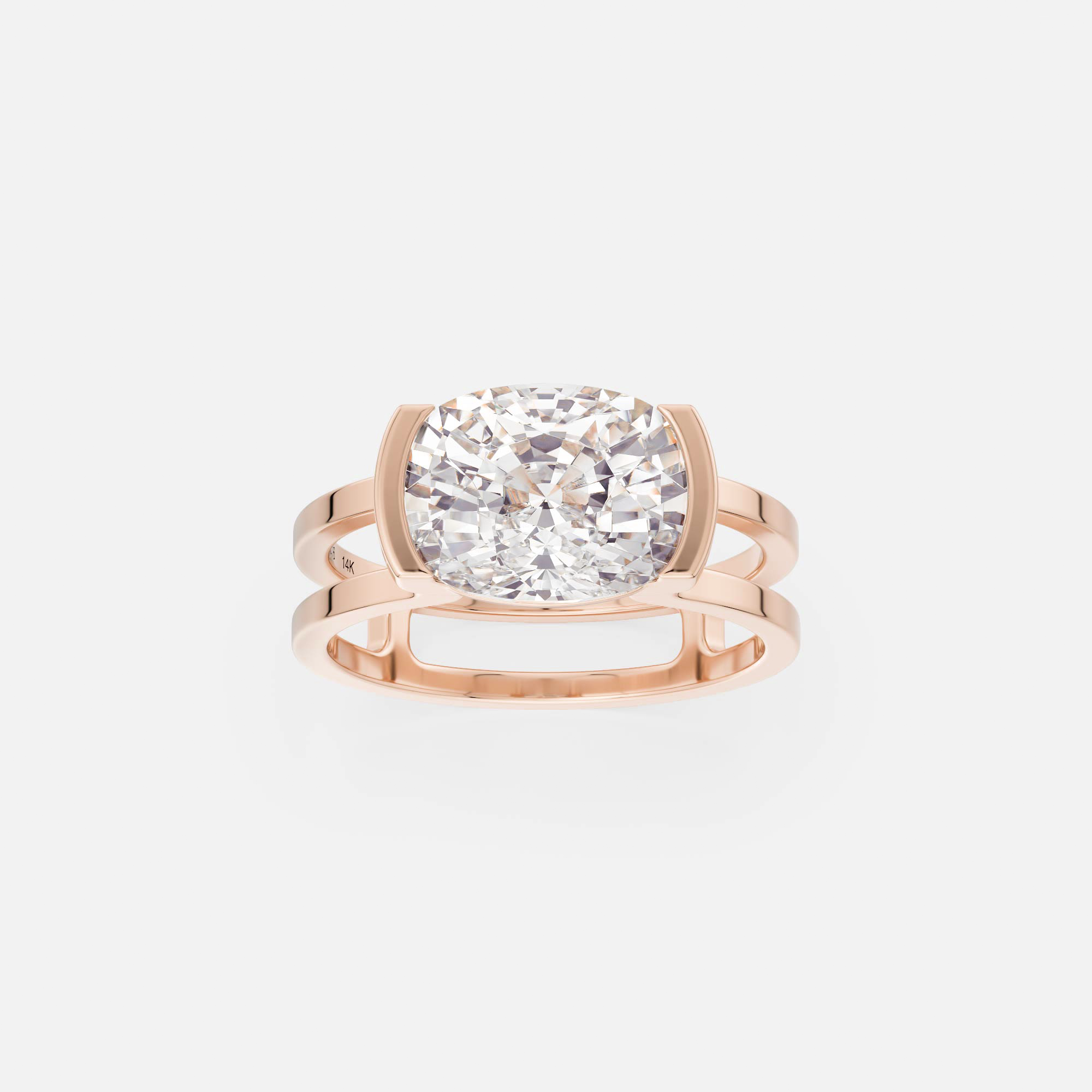 platinum engagement ring with east-west cushion cut diamond in sculptural open partial bezel setting