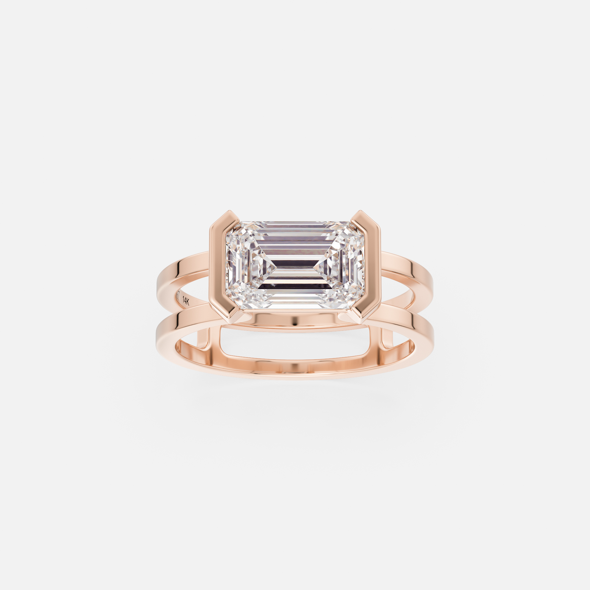 14k rose gold 1.75 carat east-west emerald diamond engagement ring with double band and tapering bezel
