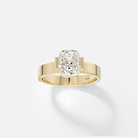 14k yellow gold wide flat band engagement ring with 1.50 carat elongated cushion diamond in partial bezel setting