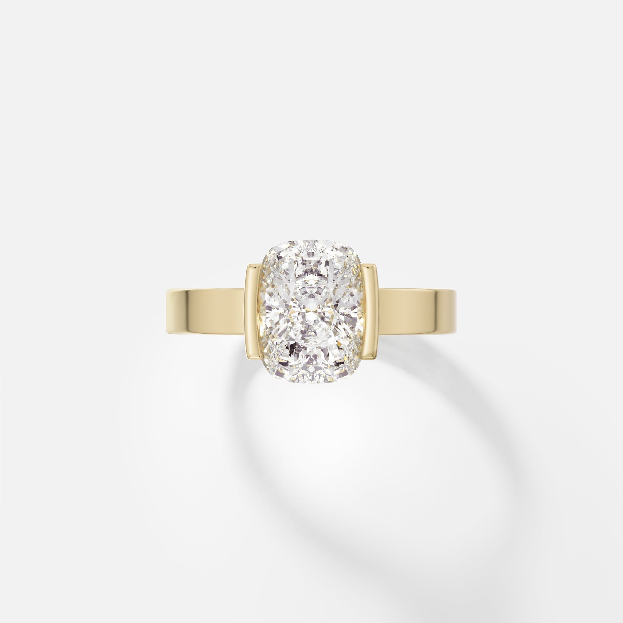 14k yellow gold engagement ring with 2.00 carat cushion-cut diamond set north-south in tapered partial bezel on wide flat band