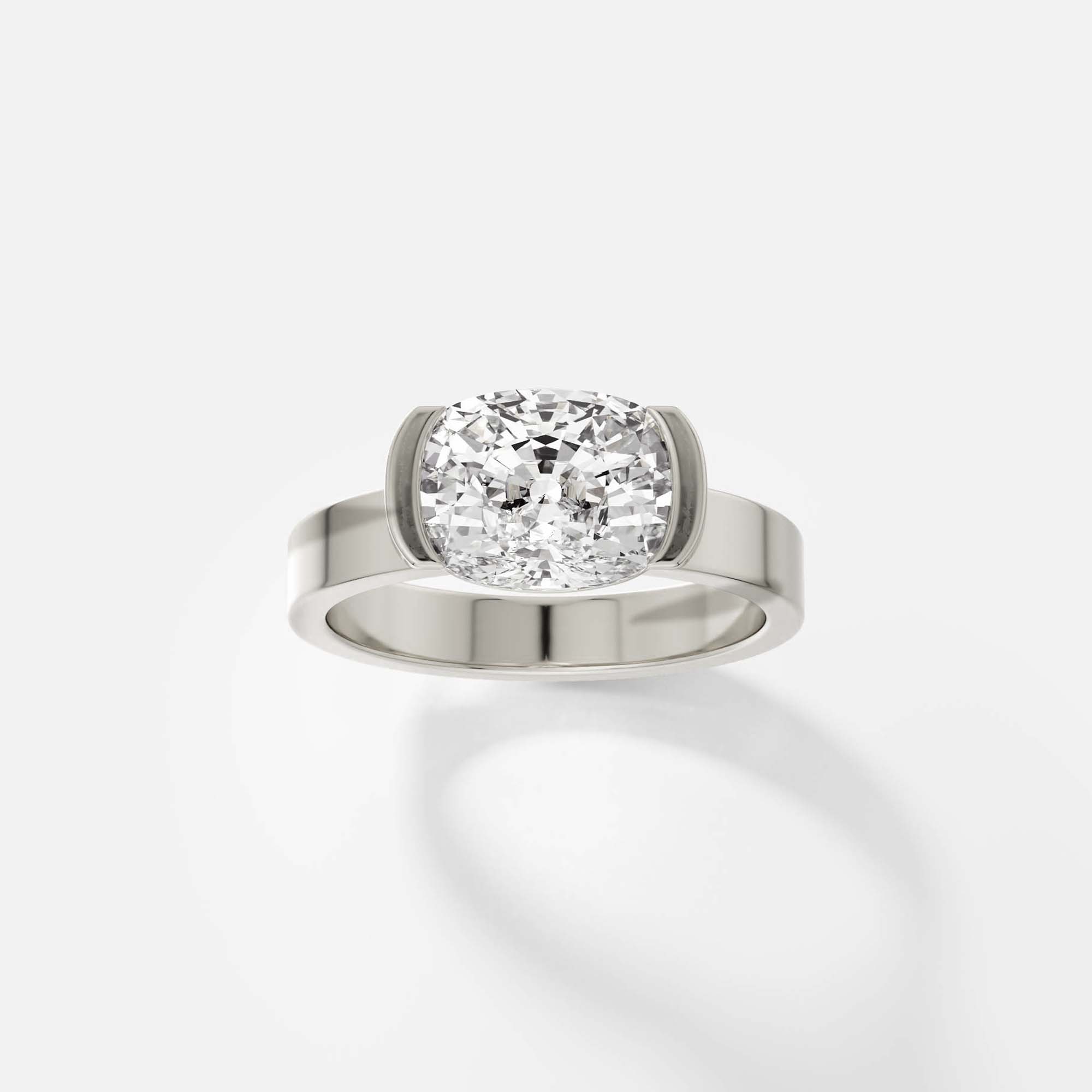 14k white gold engagement ring with 2.00 ct east-west cushion diamond in tapered partial bezel setting