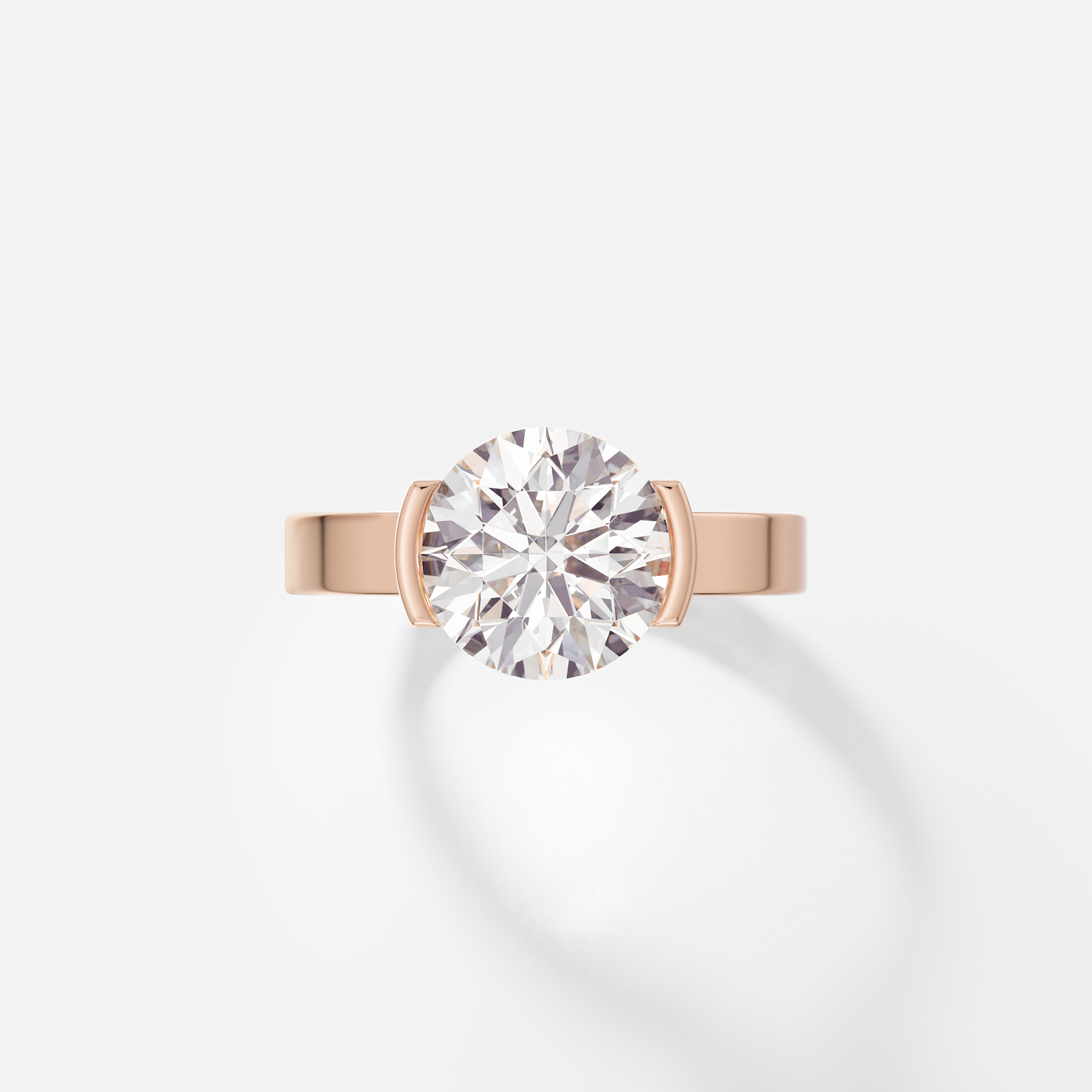 14k rose gold engagement ring with 2.50 carat round brilliant diamond set in tapering partial bezel