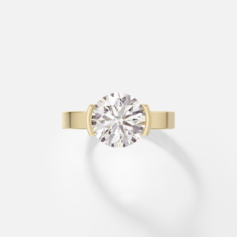 14k yellow gold engagement ring with 2.50 carat round brilliant diamond set in tapered partial bezel on wide flat band