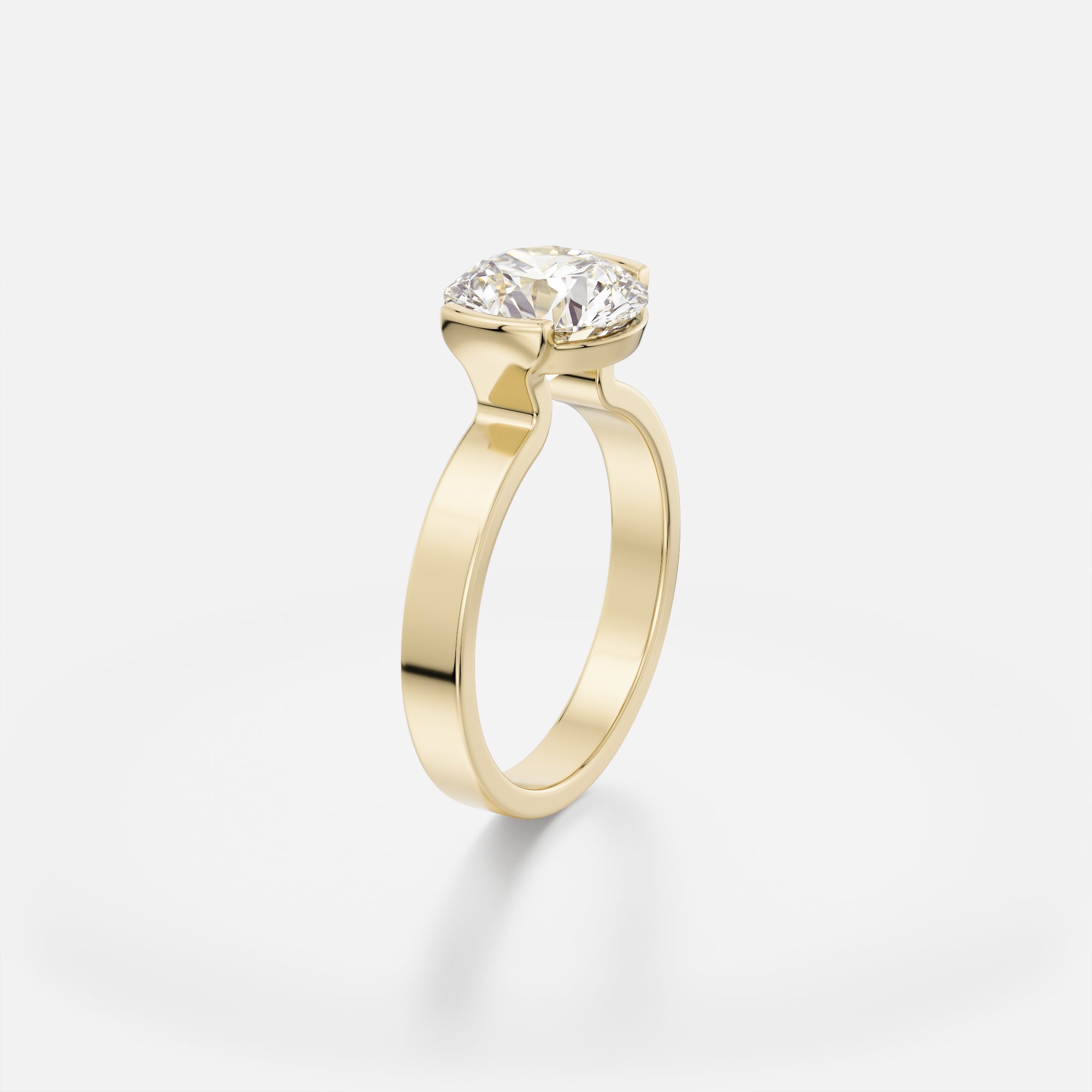 2.50 carat round brilliant-cut diamond engagement ring with tapering partial bezel setting on sculptural flat band