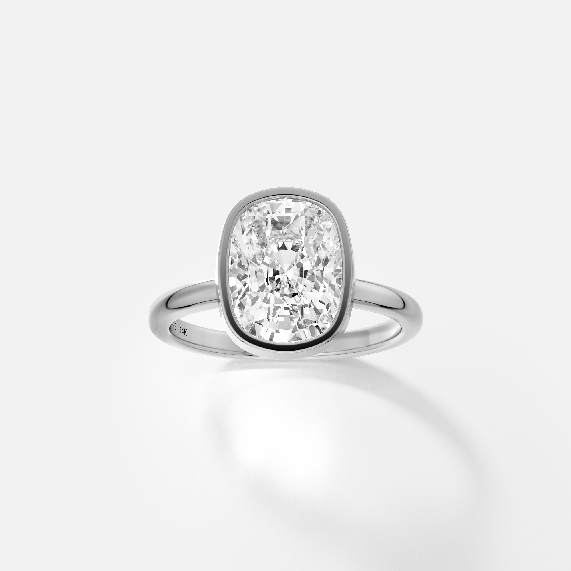 Syd elongated cushion diamond bezel engagement ring front view in platinum