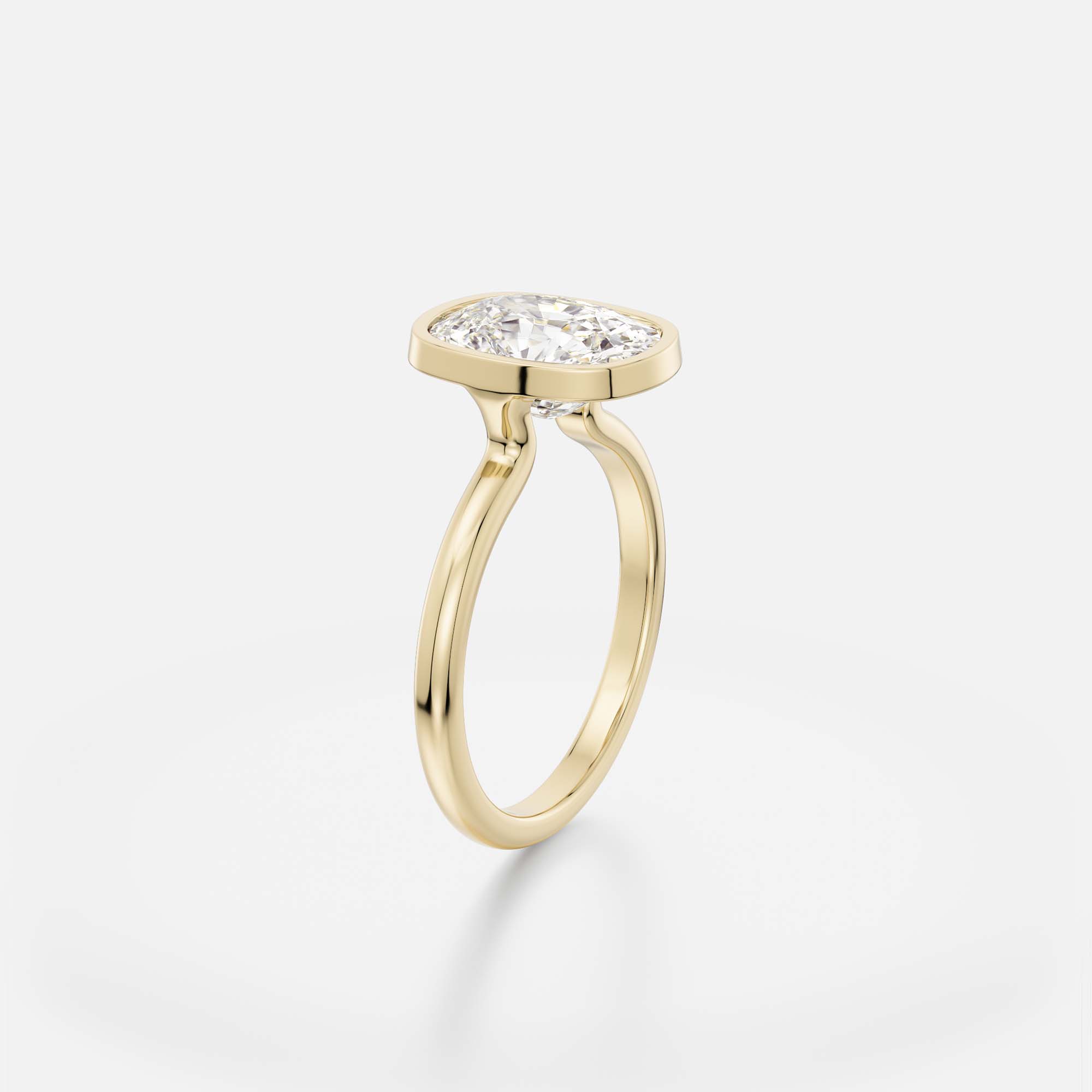 3.50 carat elongated cushion diamond engagement ring with slim bezel setting and open profile on domed band