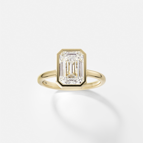 Syd emerald cut diamond bezel engagement ring front view in 14k yellow gold