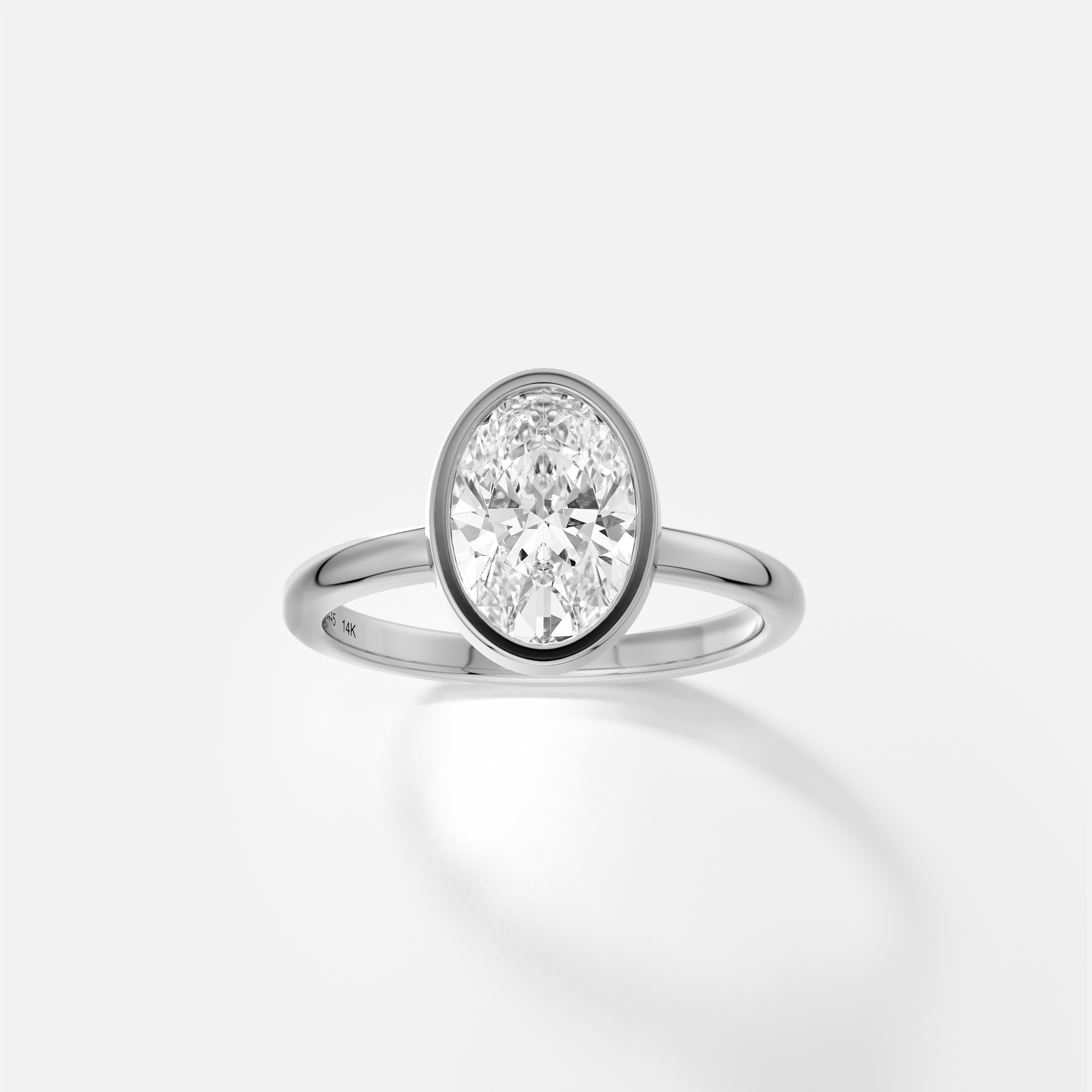 Syd oval diamond bezel engagement ring front view in platinum