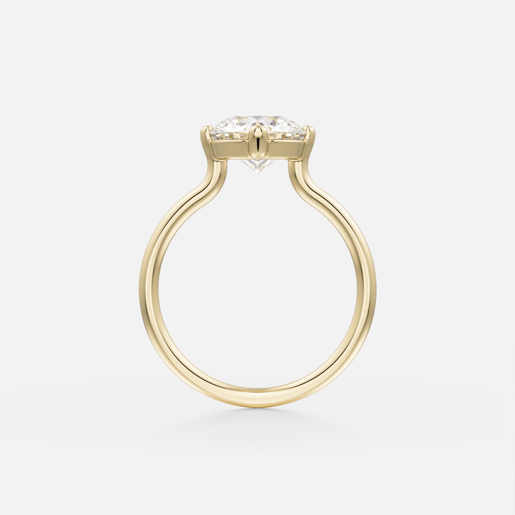 14 karat yellow gold engagement ring with round brilliant diamond held in compass prongs on slender round band