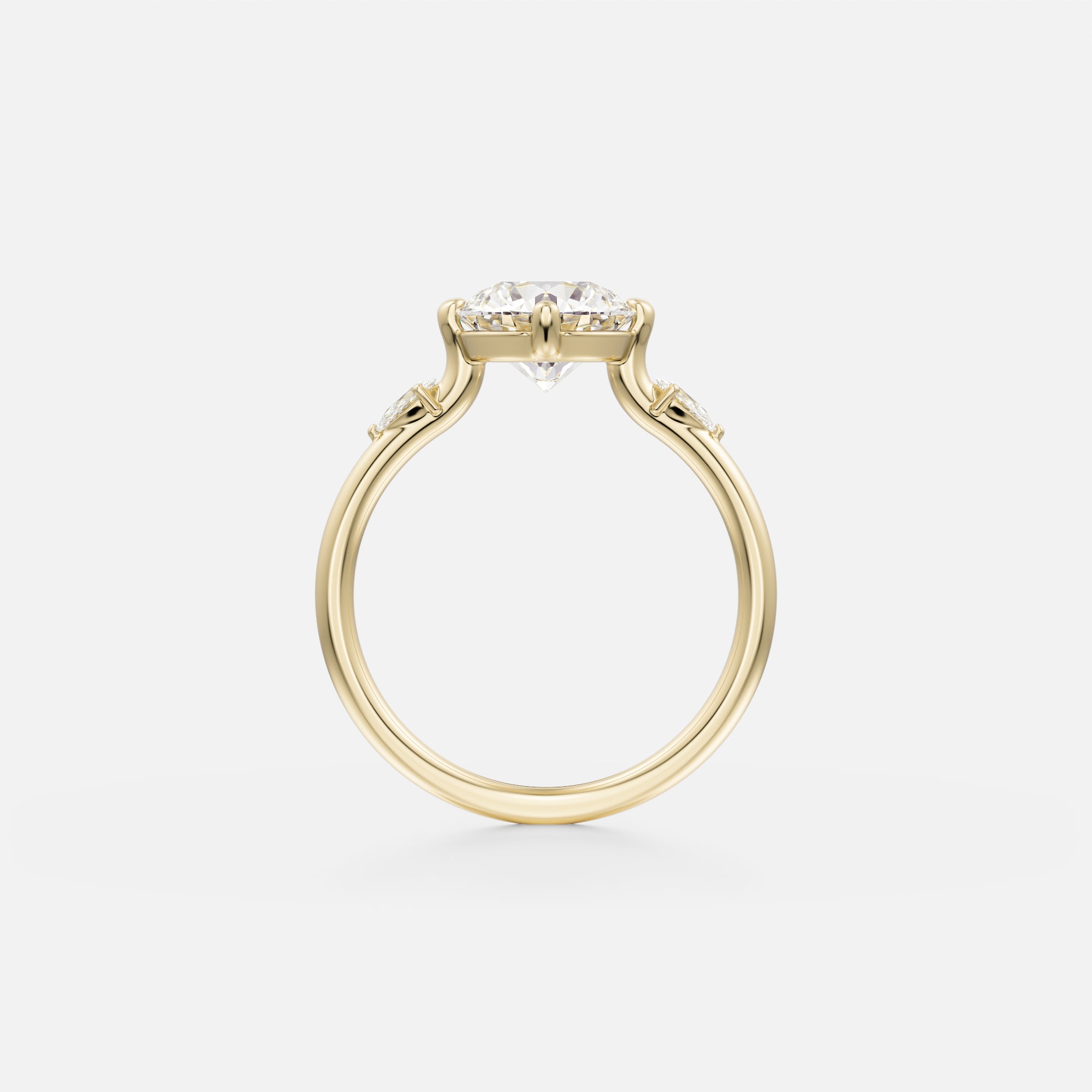 14 karat yellow gold engagement ring with round brilliant diamond prong set in compass orientation and pear-cut side stones along band