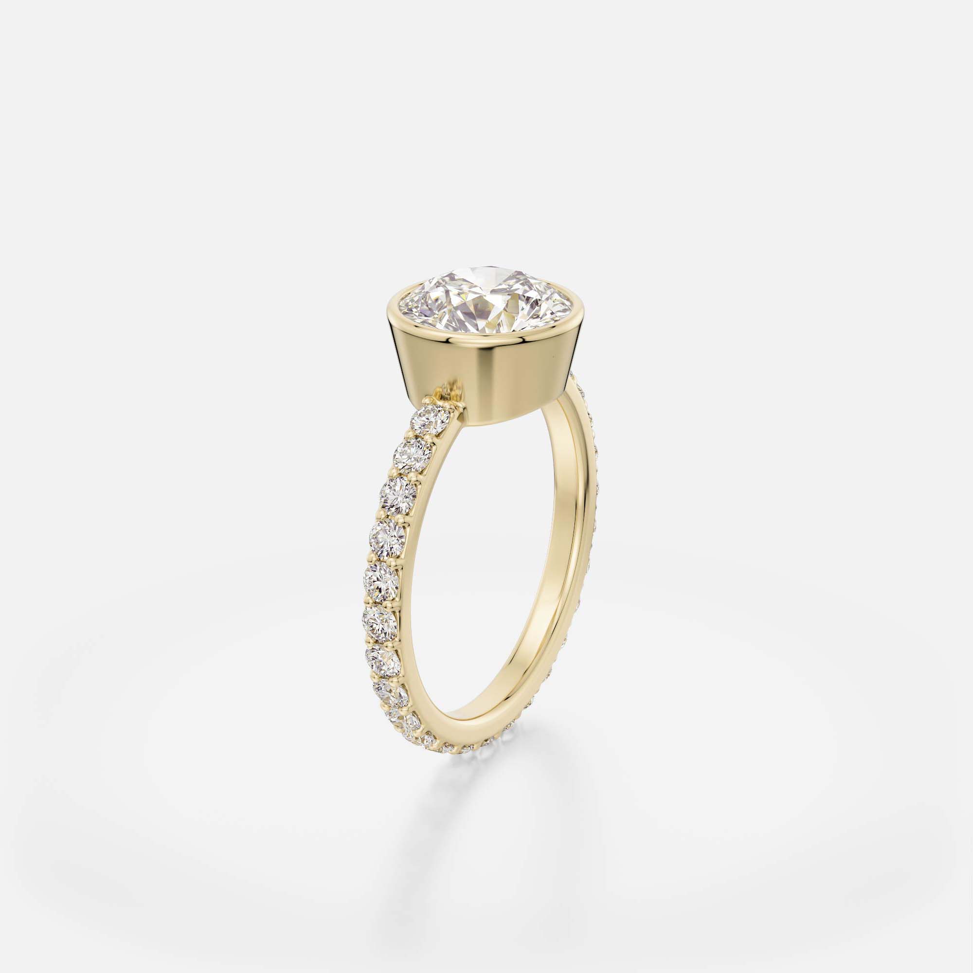 Modern bezel set diamond engagement ring with pavé diamond half eternity band on flat profile band