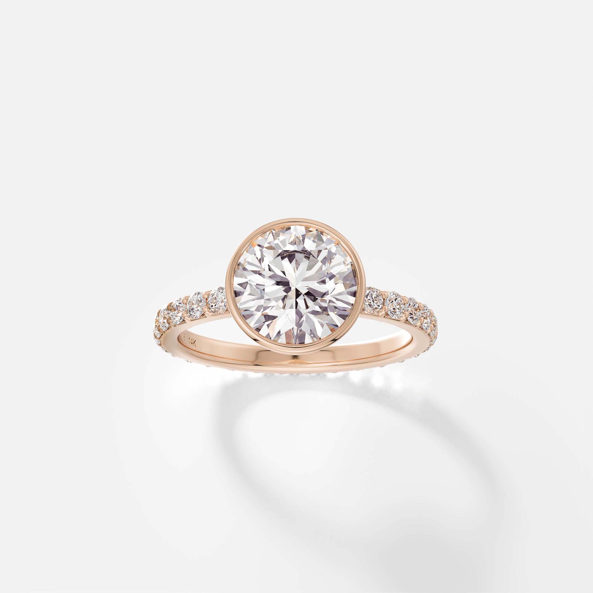 Tulpe bezel diamond pavé band engagement ring front view in 14k rose gold